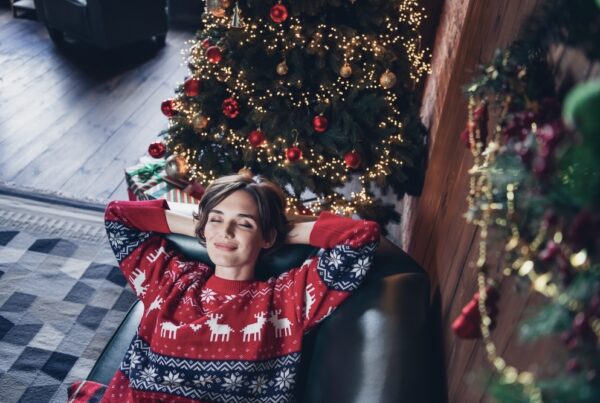 Woman lying down on the couch with a calm, contented face