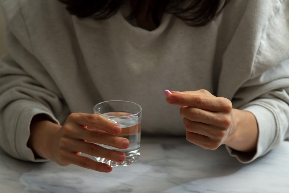 Person holding a medicine undergoing treatment for schizophrenia