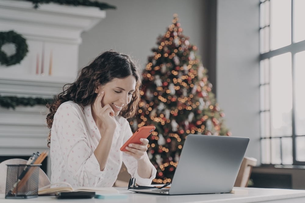 Woman messaging family to connect with them during the holidays