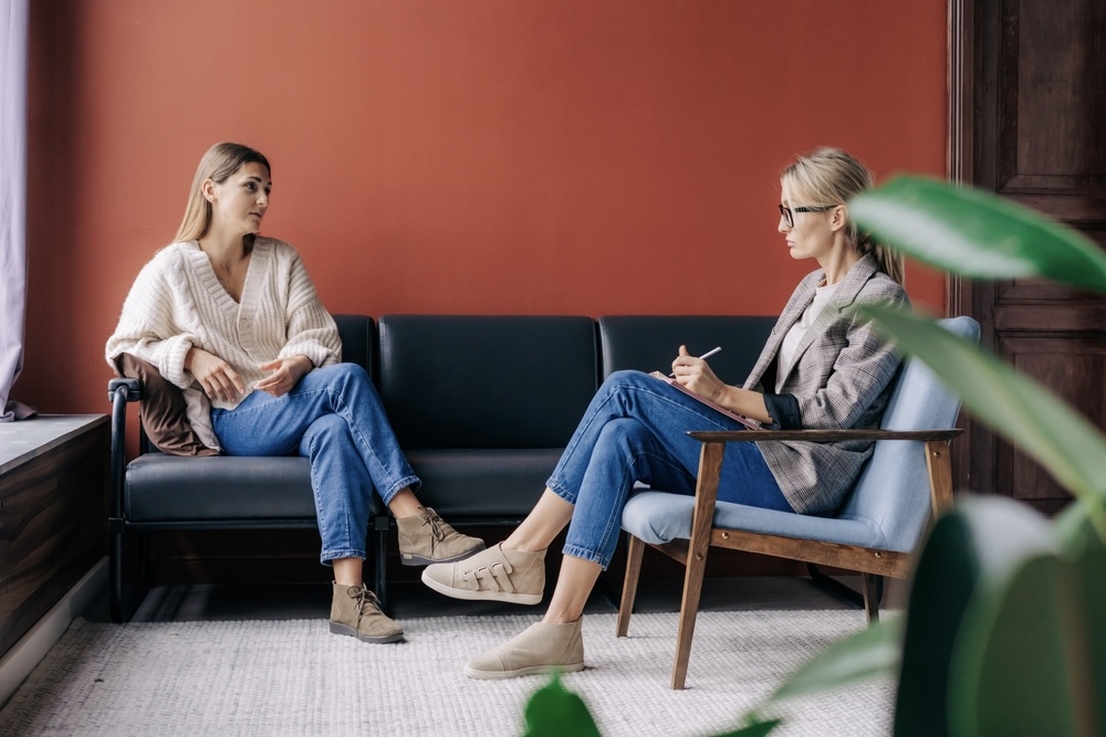 Woman speaking to a mental health professional