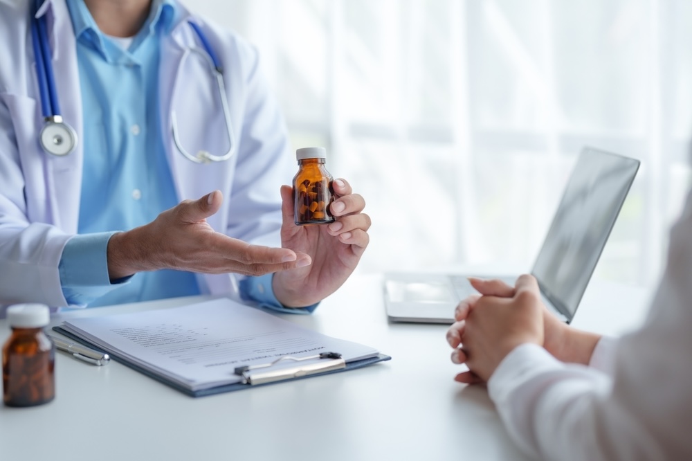 Psychiatrist holding a bottle of anxiety medication