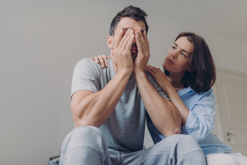 Woman comforting her partner suffering from anxiety